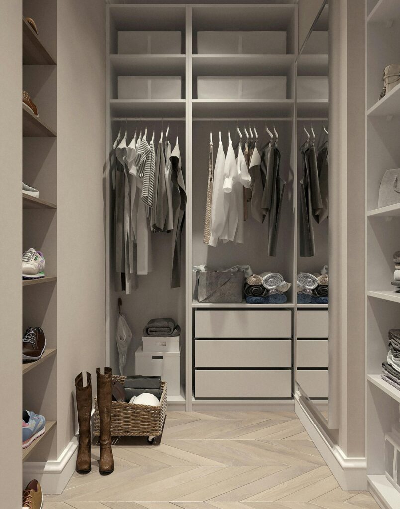 organized walk in closet, with clothes and shoes nicely staged